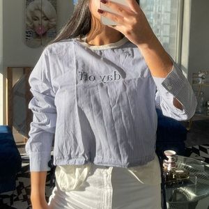 White & blue long sleeve quote